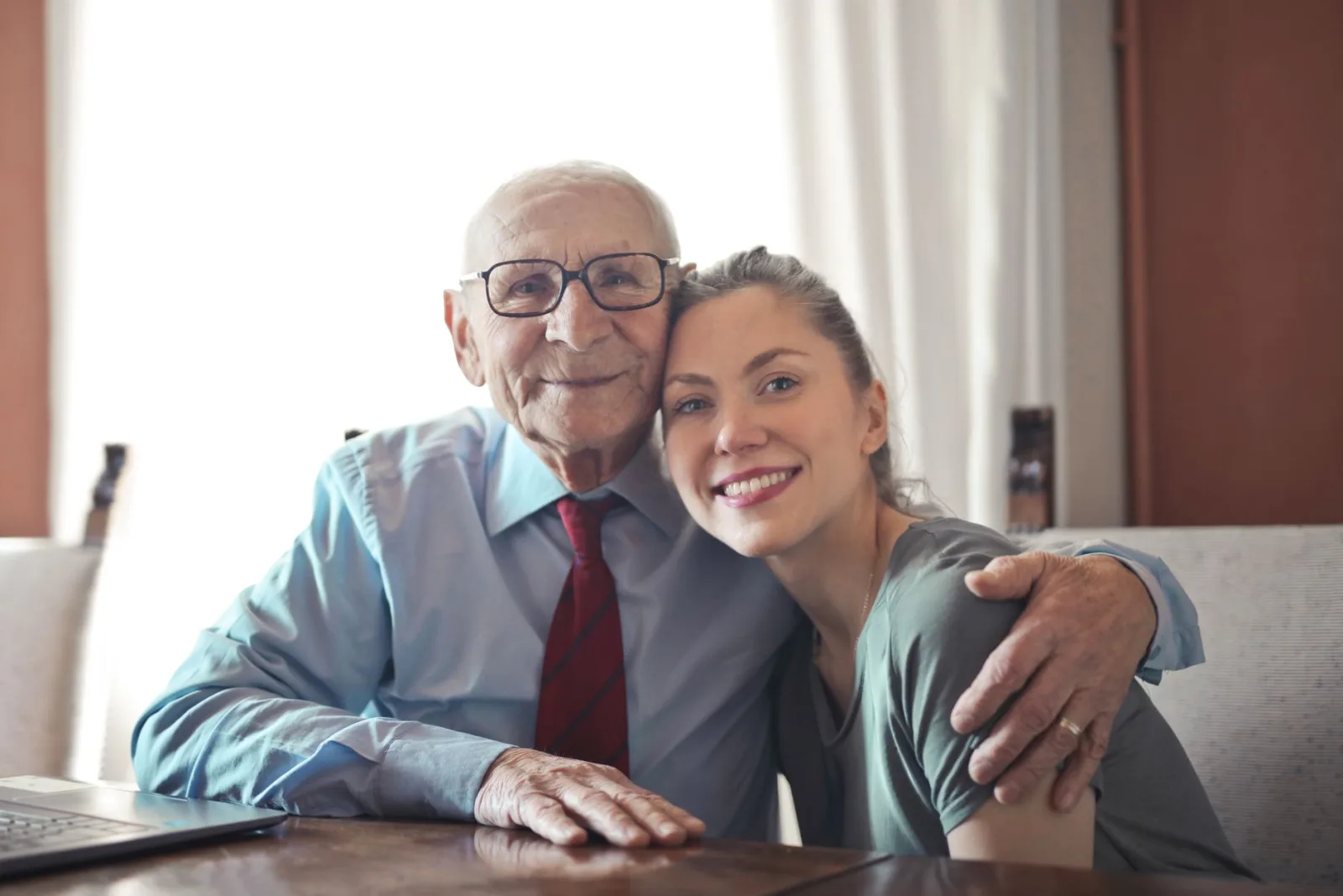 A Bluelake caregiver with a client at home